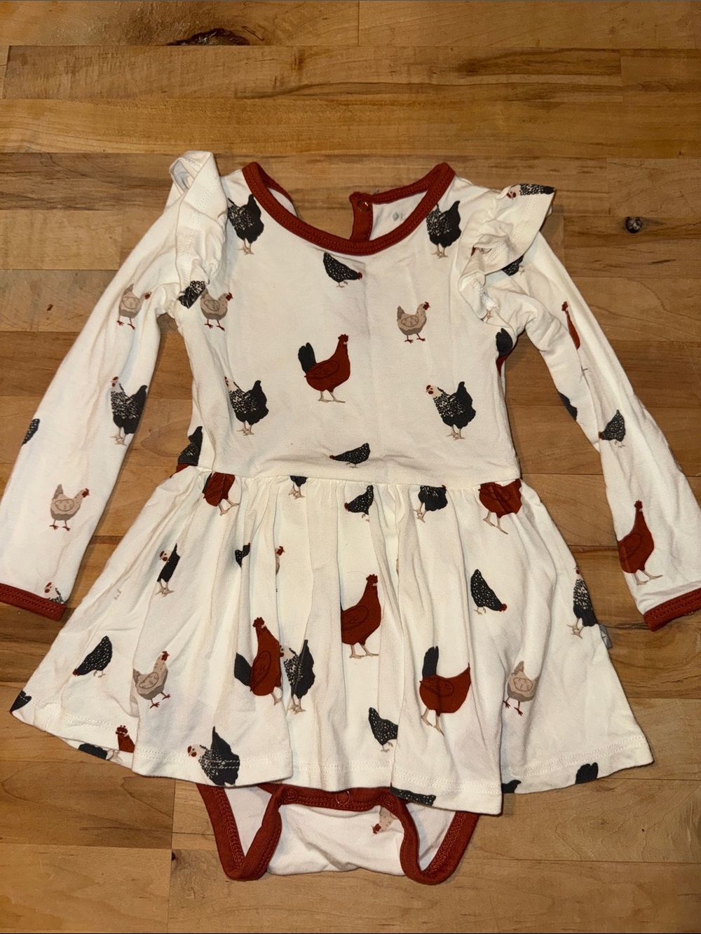 Kyte BABY Cream Dress Bodysuit with Rust & Black Hen Print